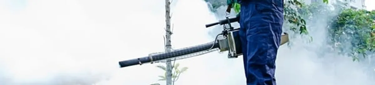Pest control technician fogging an outdoor area for insect control in Philadelphia, PA