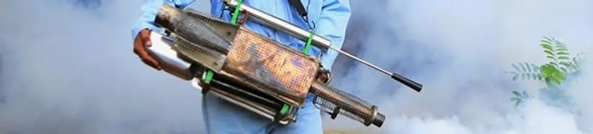 Fumigation technician using a fogger for deep pest treatment in Philadelphia, PA
